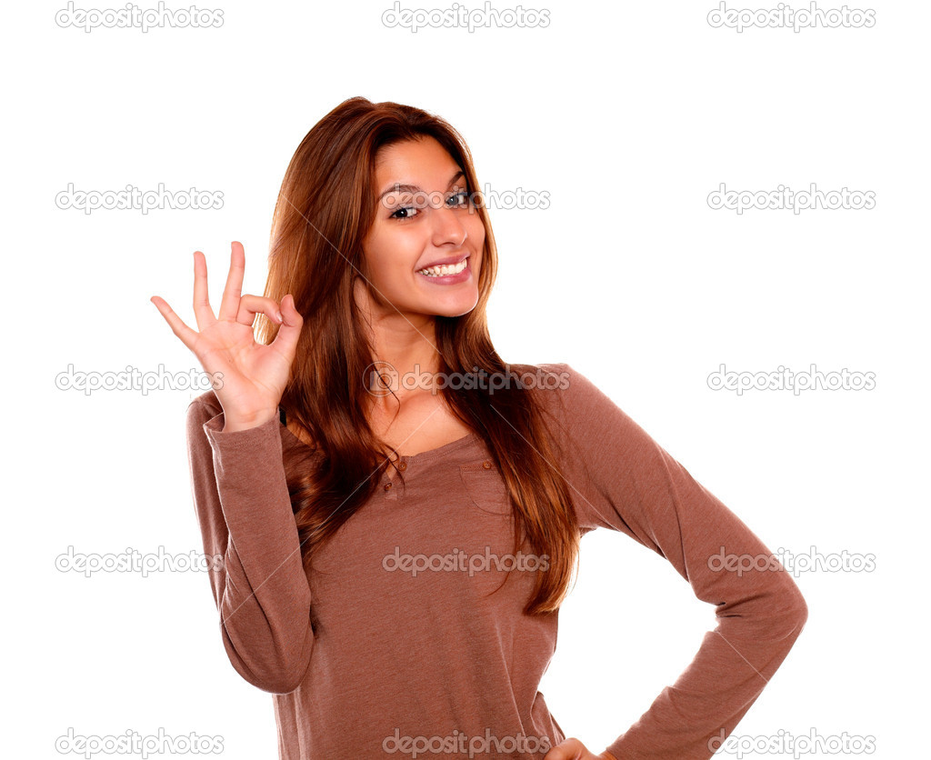 Smiling young woman saying great job with her hand