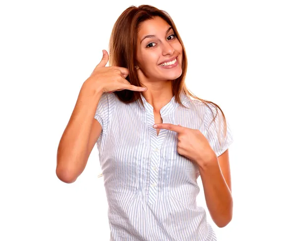 Smiling young woman pointing and saying call me — Stock Photo, Image