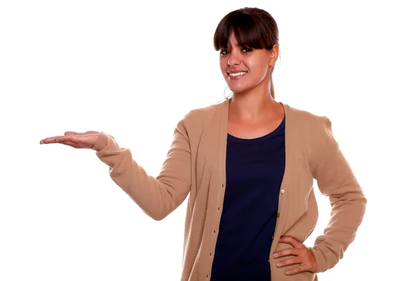 Young female holding out her palm looking at you — Stock Photo, Image