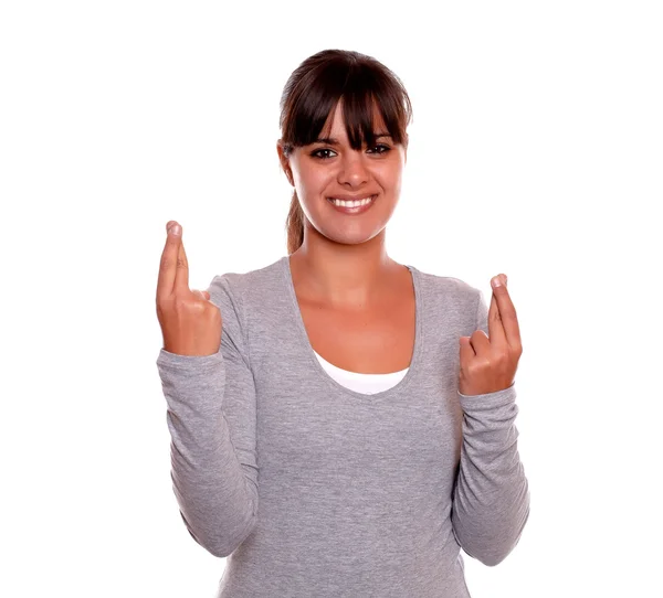 Smiling young woman crossing her fingers for luck — Stock Photo, Image