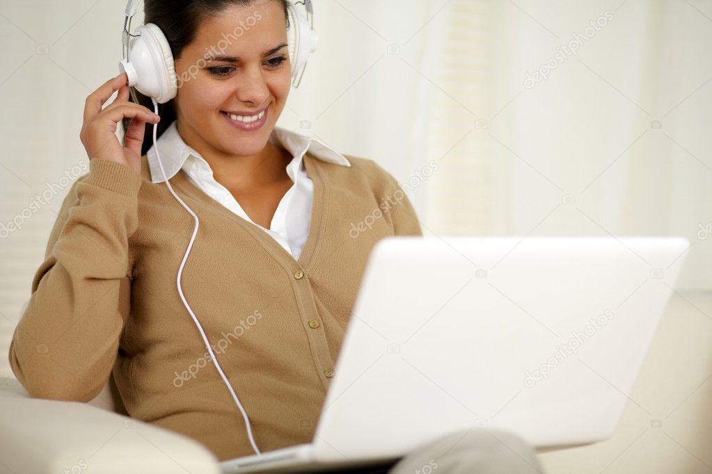 Chaming young woman with headphone listening music