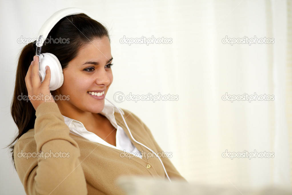 Young woman with headphone listening music