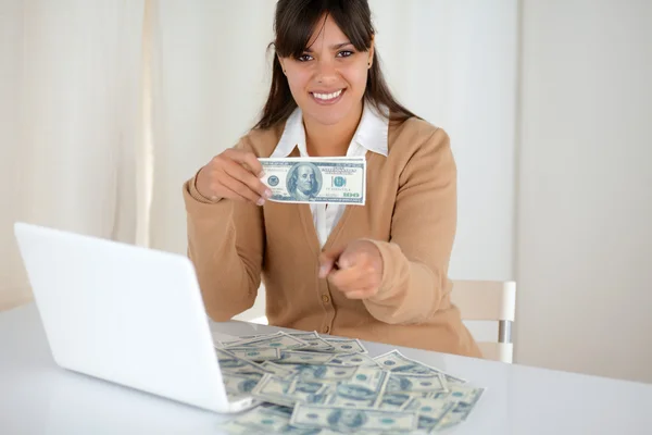 Young woman holding and showing you cash dollars — Stock Photo, Image