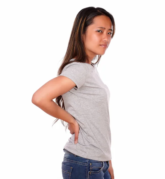 Asiático encantador jovem mulher com dor nas costas — Fotografia de Stock