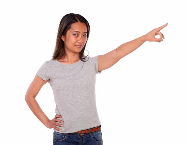 Charming asiatic young woman pointing to left up — Stock Photo, Image