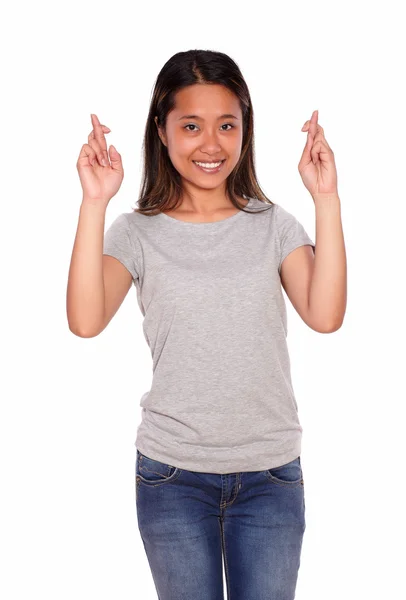 Ethnic smiling young woman crossing the fingers — Stock Photo, Image