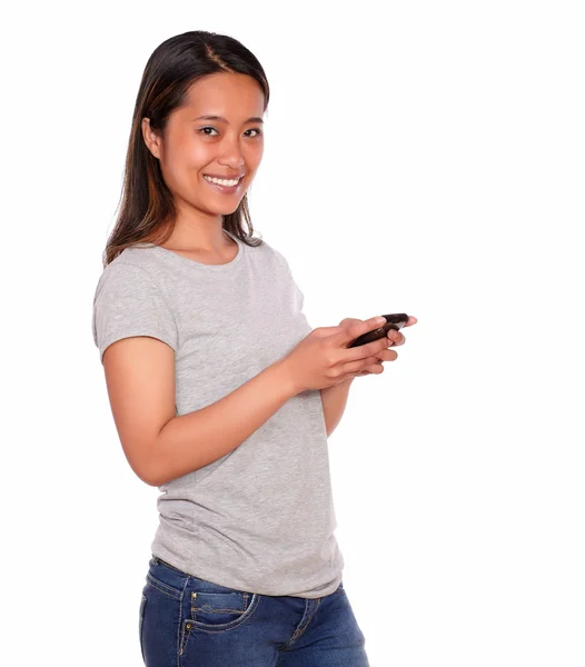 Asiatic charming young woman using her cellphone — Stock Photo, Image