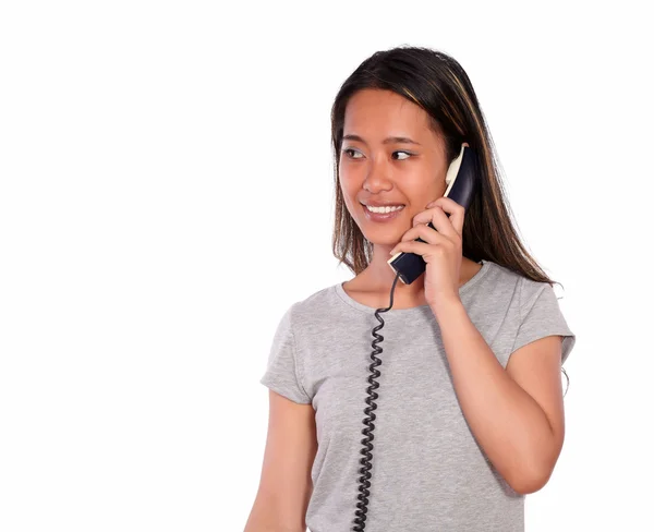 Smiling asiatic young woman speaking on phone — Stock Photo, Image