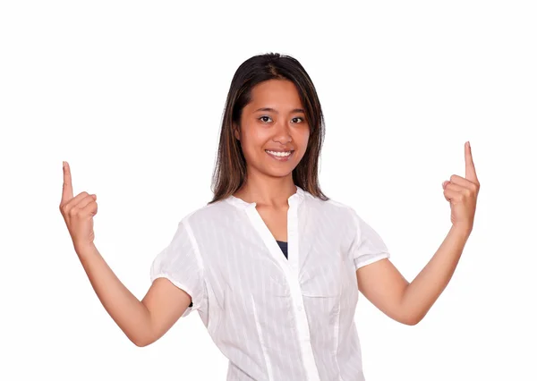 Asiatic young woman looking at you and pointing up — Stock Photo, Image