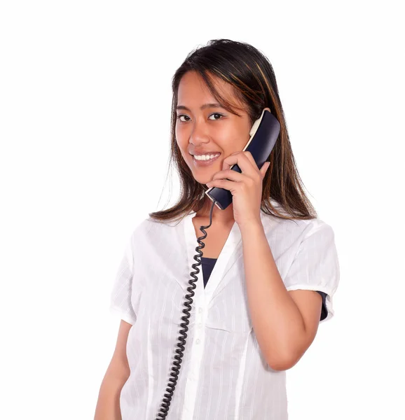 Smiling asiatic young woman speaking on phone — Stock Photo, Image