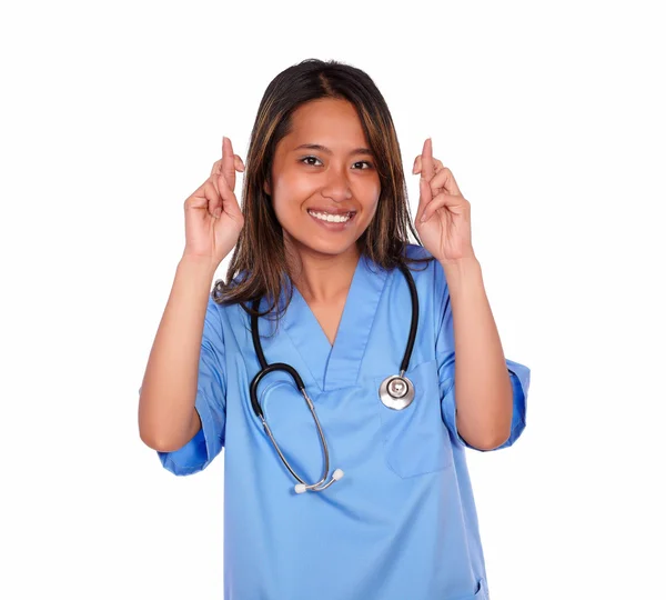 Jonge Aziatische verpleegster vrouw kruising haar vingers — Stockfoto