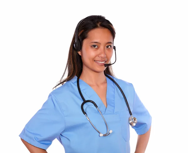 Young asiatic medical woman using headphones — Stock Photo, Image