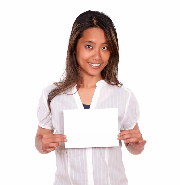 Charming ethnic young woman holding a white card — Stock Photo, Image