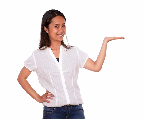 Charming asiatic woman holding out her left palm — Stock Photo, Image