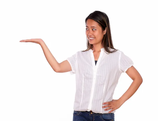 Charming asiatic woman holding out her right palm — Stock Photo, Image