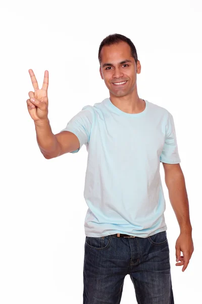 Charming young man showing you victory sign — Stock Photo, Image
