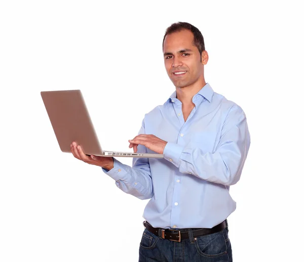 Smiling adult man working on laptop computer — Stok Foto