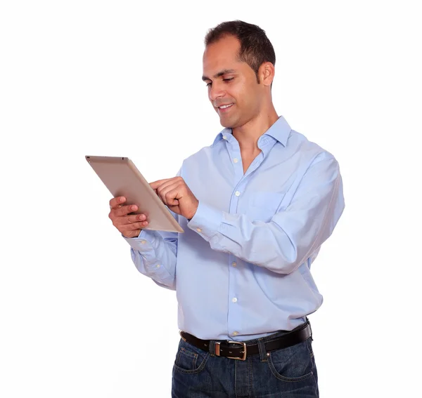 Latin adult man using his tablet pc — Stock Photo, Image