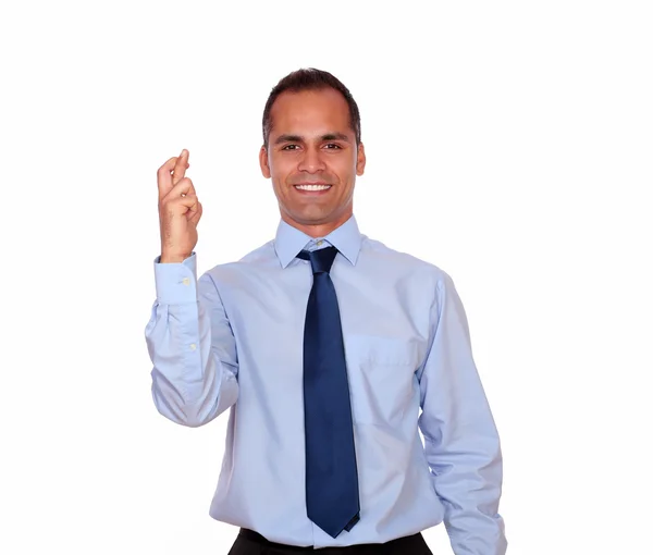 Smiling man crossing his fingers looking at you — Stock Photo, Image