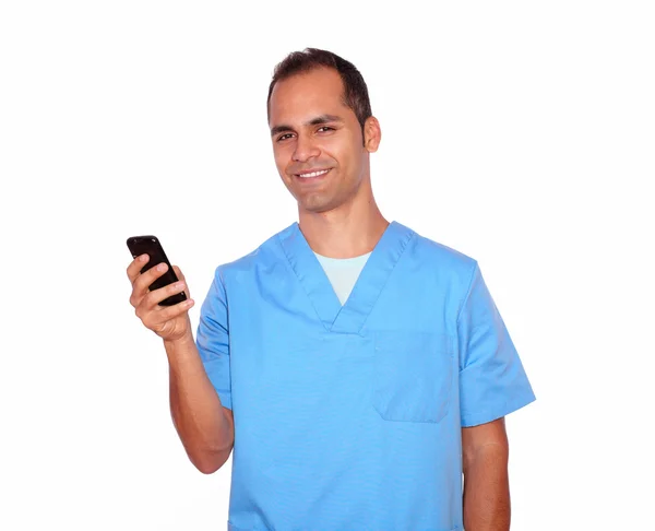 Smiling masseur sending a message on cellphone — Stock Photo, Image