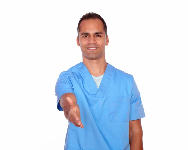 Attractive nurse gesturing a greeting with hand — Stock Photo, Image