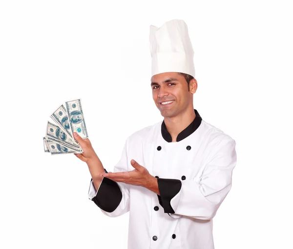 Happy person in cook uniform holding cash money — Stock Photo, Image