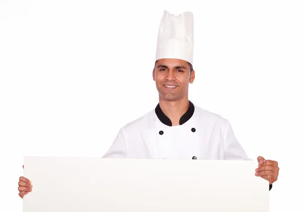 Affascinante ragazzo chef in possesso di un bianco cartello — Foto Stock