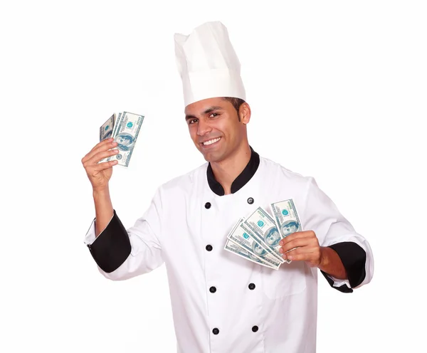 Macho feliz em uniforme chef segurando dinheiro em dinheiro — Fotografia de Stock