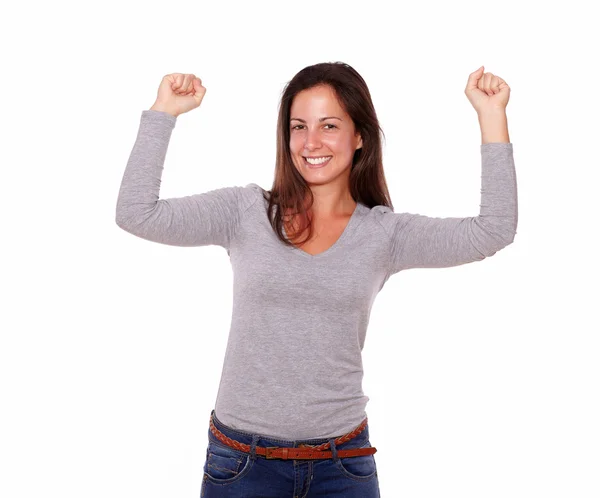 Happy female celebrating a victory smiling at you — Stock Photo, Image