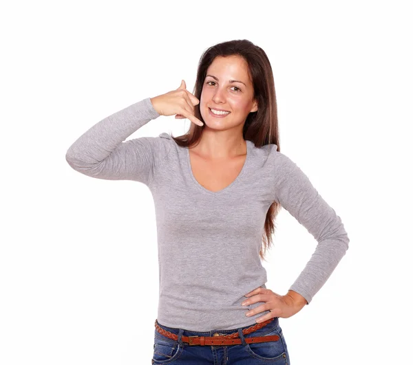 Smiling lady showing call me gesture with hand — Stock Photo, Image