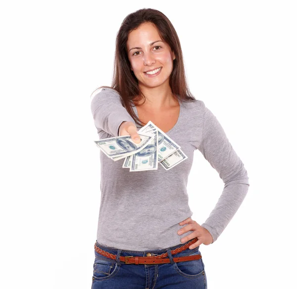 Lovely young woman holding dollars while standing — Stock Photo, Image