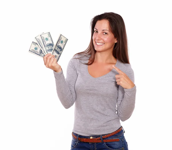 Lovely lady holding dollars while standing — Stock Photo, Image