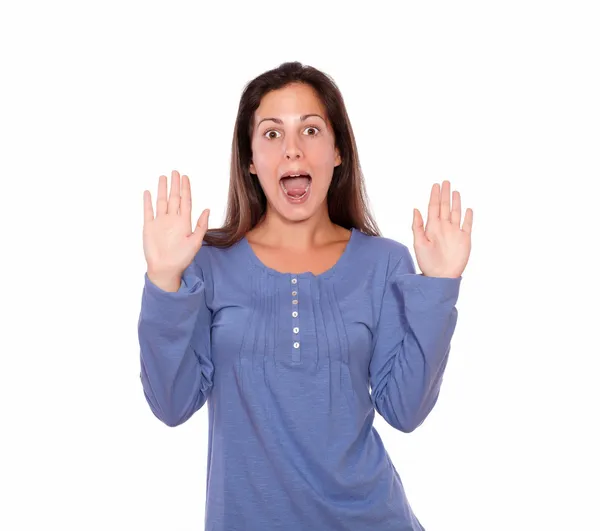 Surprised woman standing with hands up — Stock Photo, Image