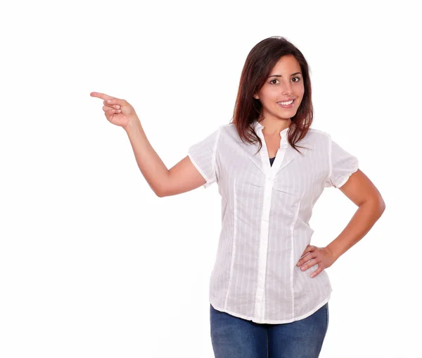 Cute hispanic woman pointing to her right — Stock Photo, Image