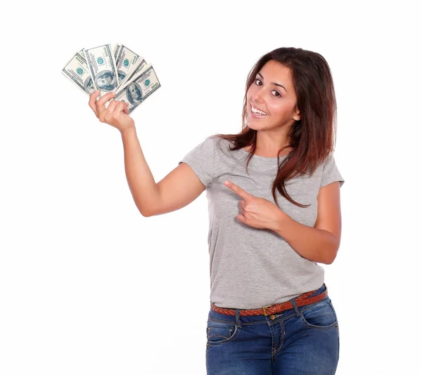 Encantadora joven sosteniendo dólares en efectivo — Foto de Stock