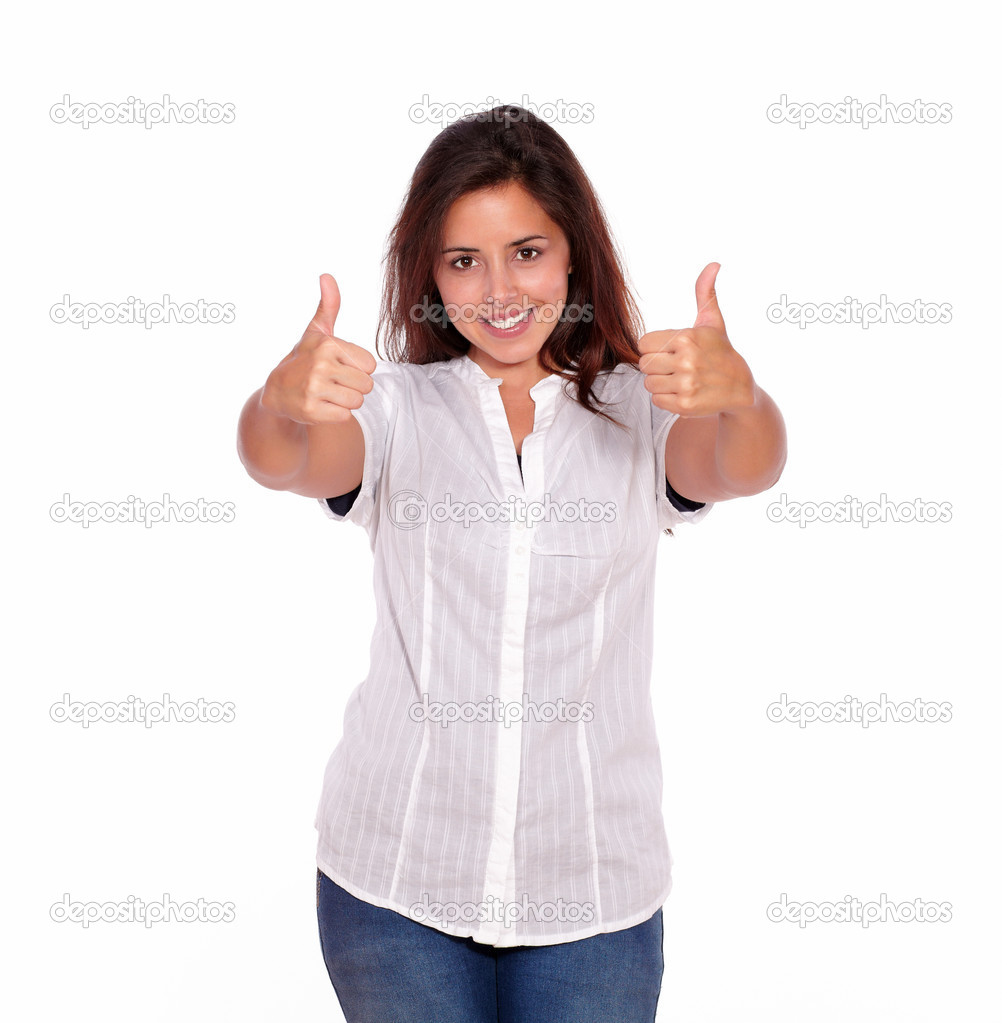 Smiling young woman gesturing positive sign
