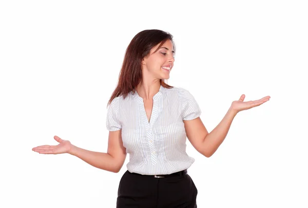 Lachende vrouw op zoek links met palmen omhoog — Stockfoto