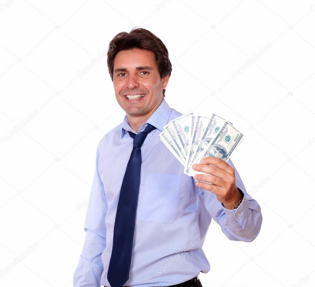 Smiling business man holding up cash money