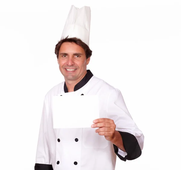 Affascinante chef con una carta bianca di copyspace — Foto Stock