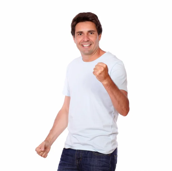 Cheerful guy celebrating victory while standing — Stock Photo, Image