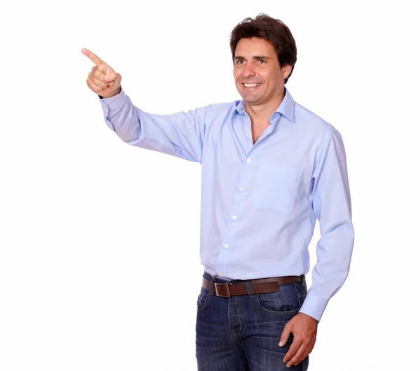 Charming man pointing to his right while standing — Stock Photo, Image