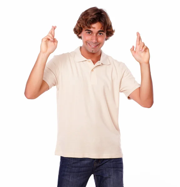 Attractive man crossing fingers while smiling — Stock Photo, Image