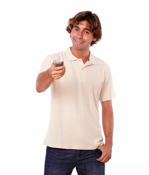 Handsome man pointing with the remote — Stock Photo, Image