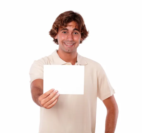 A young man smiling holding a card. — Stock Photo, Image