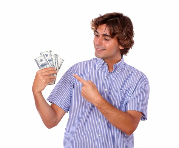 Stilvoller Mann lächelt, während er auf die Währung zeigt — Stockfoto