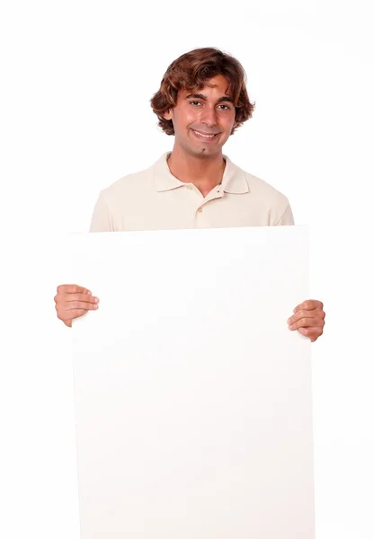 Charismatic man standing holding a blank placard. — Stock Photo, Image