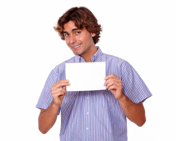 Charming young man holding a blank card — Stock Photo, Image