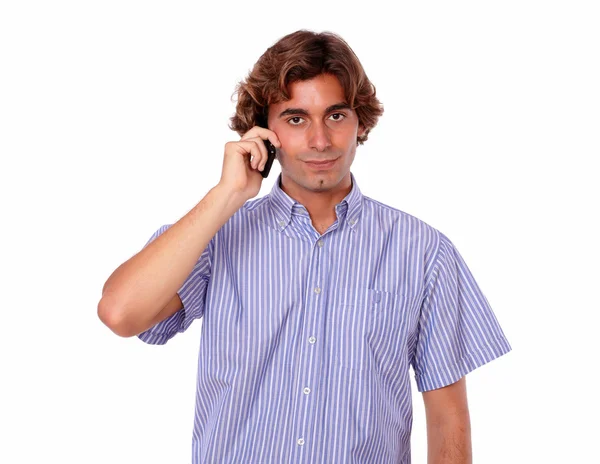 Handsome young man speaking on cellphone — Stock Photo, Image