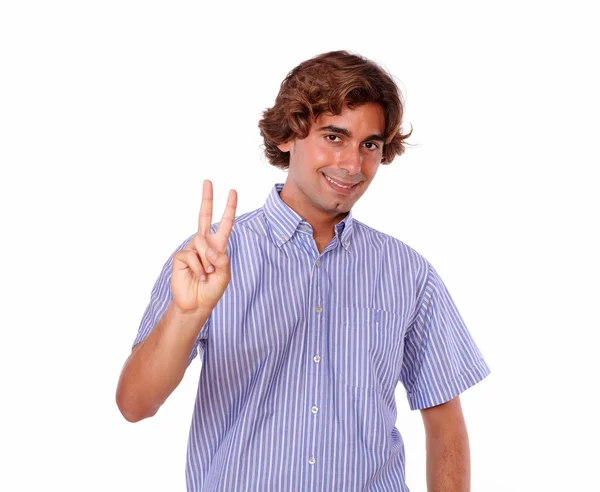 Charming young man showing you victory sign — Stock Photo, Image