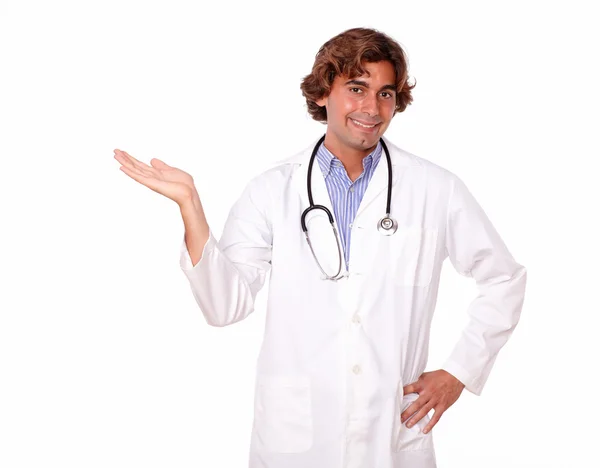 Handsome medical doctor holding out his palm — Stock Photo, Image